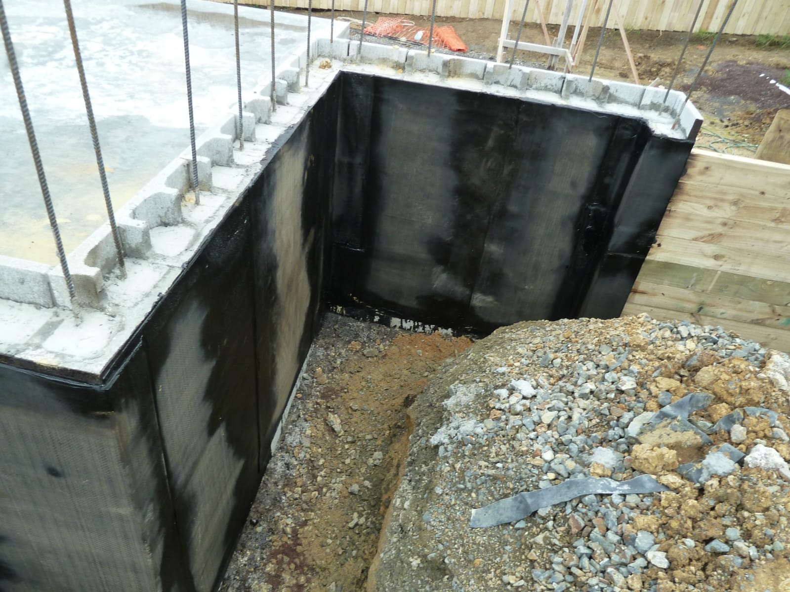Below-ground wall tanking waterproofing on a construction site